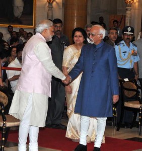 Modi shaking hand with Ansari